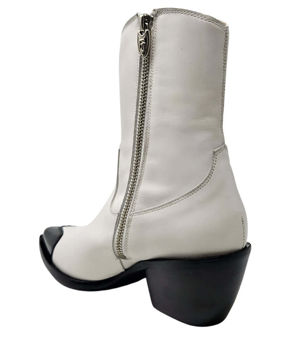 Mid-calf leather boot with block heel, side zipper, and contrasting heart-shaped toe cap. Features a structured silhouette with a pointed toe and minimal seam lines.