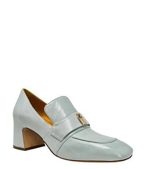 A leather loafer with a block heel, square toe, and a small metal lock detail centered on the upper strap. Designed by Madison in Beverly Hills and handcrafted in Italy.