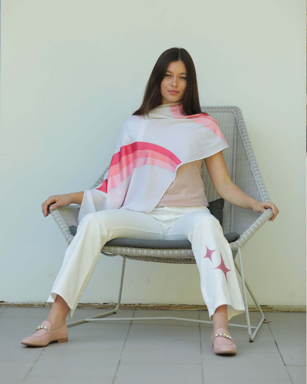 Flared-leg pants made in Italy with a mid-rise fit, featuring front and back pockets and star-shaped accents on the hip, lower leg, and back pocket. Displayed from multiple angles against a clean background