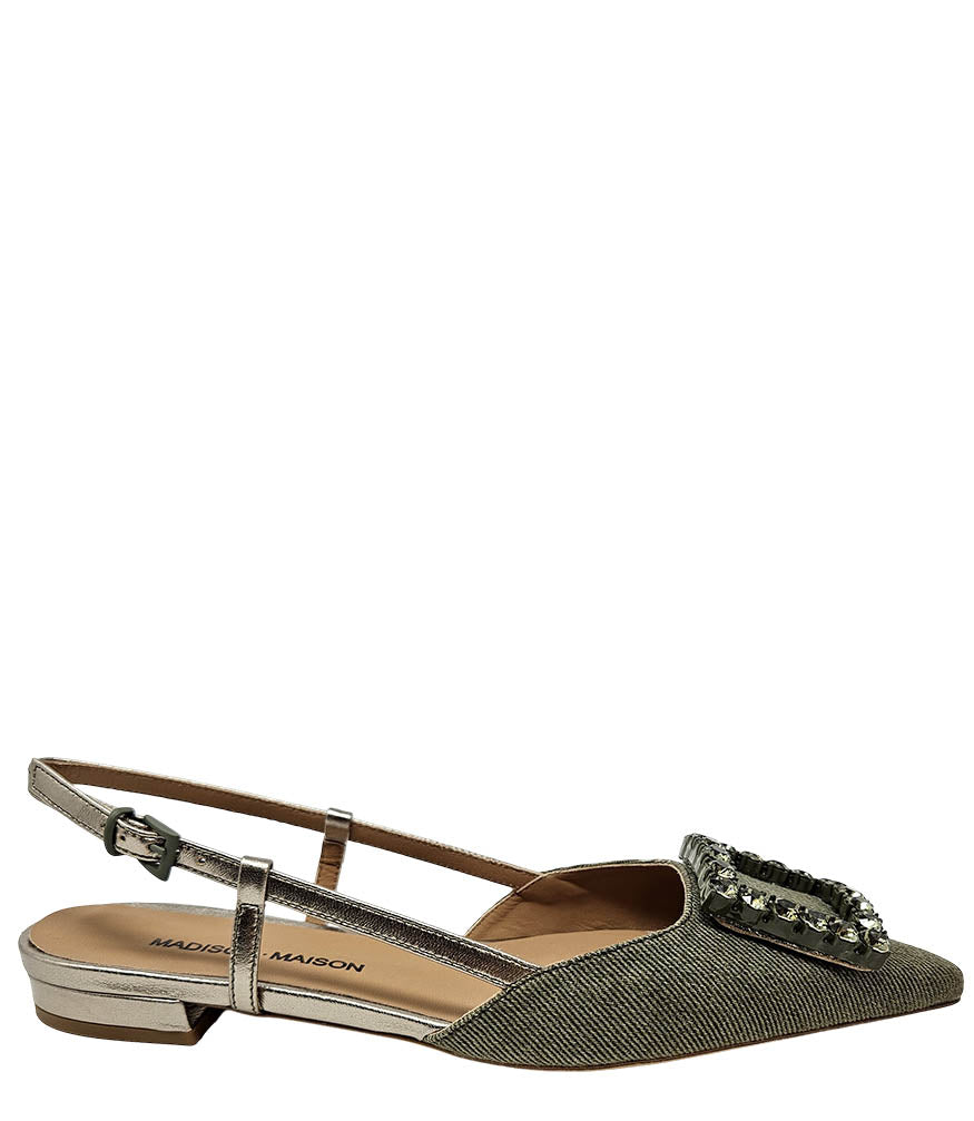 Pointed-toe slingback flat with low heel, adjustable ankle strap, and large decorative jewel embellishment on the toe. Features mixed material textures and an open heel design.