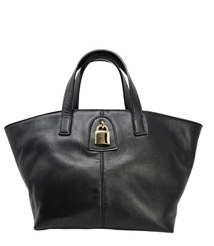 "A light grey leather tote bag with short handles and a structured silhouette, featuring a central vertical seam and a small gold padlock accent beneath the handle. Designed by Madison in Beverly Hills and handmade in Italy.
