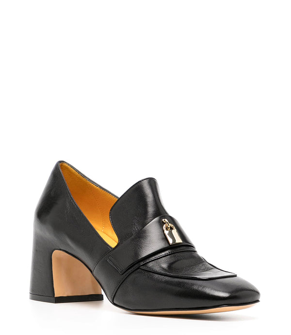 A leather loafer with a block heel, square toe, and a small metal lock detail centered on the upper strap. Designed by Madison in Beverly Hills and handcrafted in Italy.
