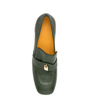 A leather loafer with a block heel, square toe, and a small metal lock detail centered on the upper strap. Designed by Madison in Beverly Hills and handcrafted in Italy.