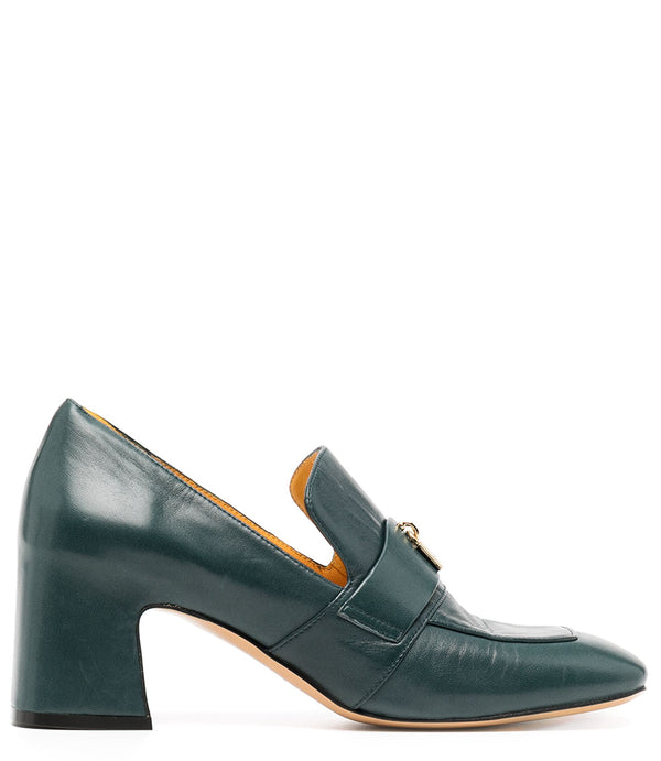A leather loafer with a block heel, square toe, and a small metal lock detail centered on the upper strap. Designed by Madison in Beverly Hills and handcrafted in Italy.