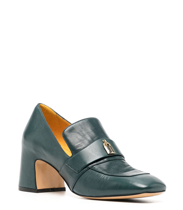 A leather loafer with a block heel, square toe, and a small metal lock detail centered on the upper strap. Designed by Madison in Beverly Hills and handcrafted in Italy.