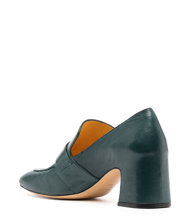 A leather loafer with a block heel, square toe, and a small metal lock detail centered on the upper strap. Designed by Madison in Beverly Hills and handcrafted in Italy.