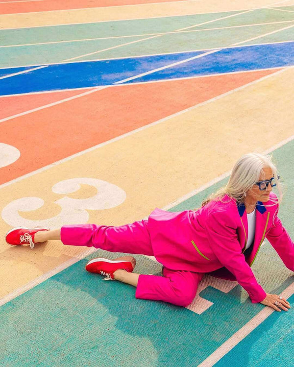 Handcrafted low-top sneaker made in Italy, featuring mixed-material construction with a star-shaped side detail, textured sole, and cushioned laces. Presented from multiple angles against a clean background.