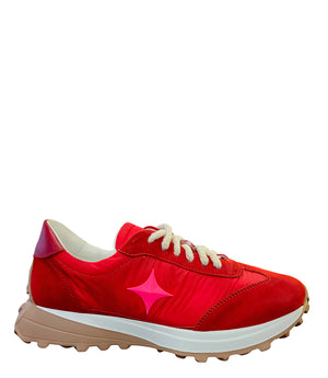 Handcrafted low-top sneaker made in Italy, featuring mixed-material construction with a star-shaped side detail, textured sole, and cushioned laces. Presented from multiple angles against a clean background.