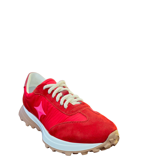 Handcrafted low-top sneaker made in Italy, featuring mixed-material construction with a star-shaped side detail, textured sole, and cushioned laces. Presented from multiple angles against a clean background.