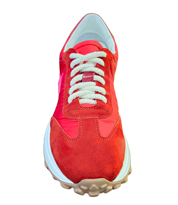 Handcrafted low-top sneaker made in Italy, featuring mixed-material construction with a star-shaped side detail, textured sole, and cushioned laces. Presented from multiple angles against a clean background.