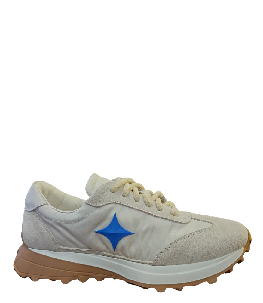 Handcrafted low-top sneaker made in Italy, featuring mixed-material construction with a star-shaped side detail, textured sole, and cushioned laces. Presented from multiple angles against a clean background.