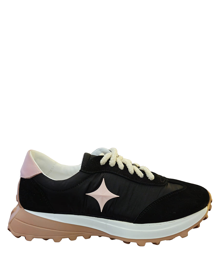Handcrafted low-top sneaker made in Italy, featuring mixed-material construction with a star-shaped side detail, textured sole, and cushioned laces. Presented from multiple angles against a clean background.