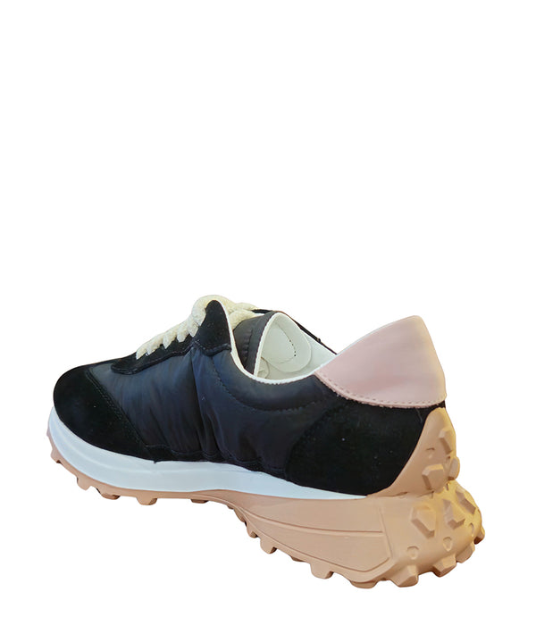Handcrafted low-top sneaker made in Italy, featuring mixed-material construction with a star-shaped side detail, textured sole, and cushioned laces. Presented from multiple angles against a clean background.