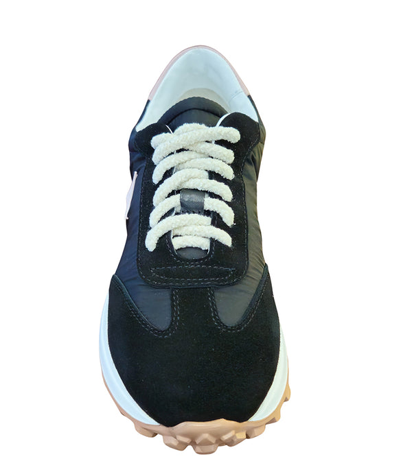 Handcrafted low-top sneaker made in Italy, featuring mixed-material construction with a star-shaped side detail, textured sole, and cushioned laces. Presented from multiple angles against a clean background.