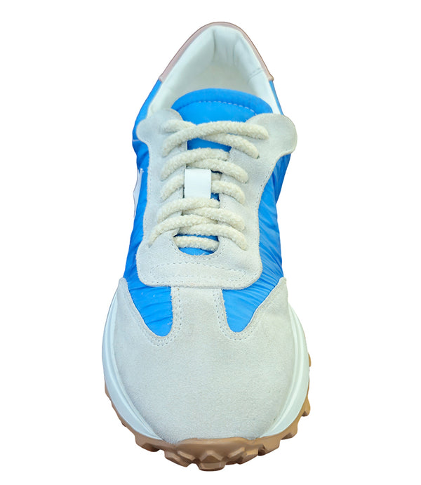 Handcrafted low-top sneaker made in Italy, featuring mixed-material construction with a star-shaped side detail, textured sole, and cushioned laces. Presented from multiple angles against a clean background.