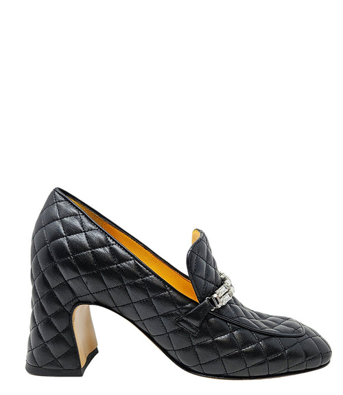 A quilted leather heeled loafer with a square toe and block heel, featuring a decorative band with rectangular gemstone-style embellishments across the upper. Designed by Madison in Beverly Hills and handcrafted in Italy