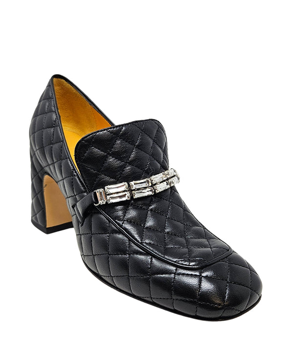 A quilted leather heeled loafer with a square toe and block heel, featuring a decorative band with rectangular gemstone-style embellishments across the upper. Designed by Madison in Beverly Hills and handcrafted in Italy