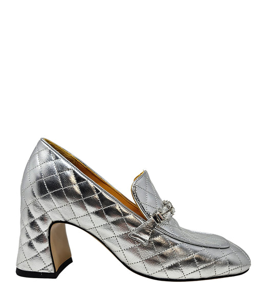 A quilted leather heeled loafer with a square toe and block heel, featuring a decorative band with rectangular gemstone-style embellishments across the upper. Designed by Madison in Beverly Hills and handcrafted in Italy