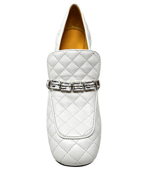 A quilted leather heeled loafer with a square toe and block heel, featuring a decorative band with rectangular gemstone-style embellishments across the upper. Designed by Madison in Beverly Hills and handcrafted in Italy