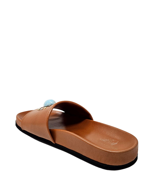 Luxury slip-on sandal handcrafted in Italy with a cushioned footbed and wide strap embellished with decorative elements. Designed by Madison Maison, photographed from multiple angles on a clean white background.