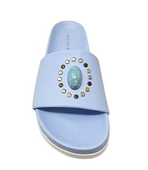 Luxury slip-on sandal handcrafted in Italy with a cushioned footbed and wide strap embellished with decorative elements. Designed by Madison Maison, photographed from multiple angles on a clean white background.