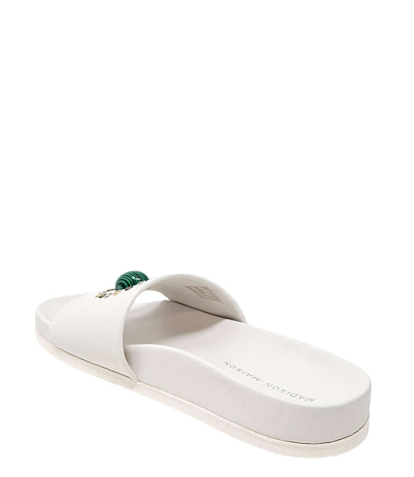 Luxury slip-on sandal handcrafted in Italy with a cushioned footbed and wide strap embellished with decorative elements. Designed by Madison Maison, photographed from multiple angles on a clean white background.
