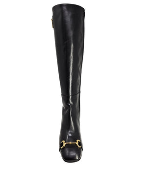 A tall leather boot with a block heel and rounded toe, featuring a metal horsebit-style detail at the front and a small metal padlock accent near the top of the shaft. Designed by Madison in Beverly Hills and handcrafted in Italy