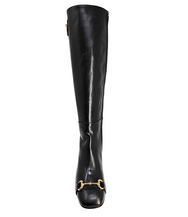 A tall leather boot with a block heel and rounded toe, featuring a metal horsebit-style detail at the front and a small metal padlock accent near the top of the shaft. Designed by Madison in Beverly Hills and handcrafted in Italy