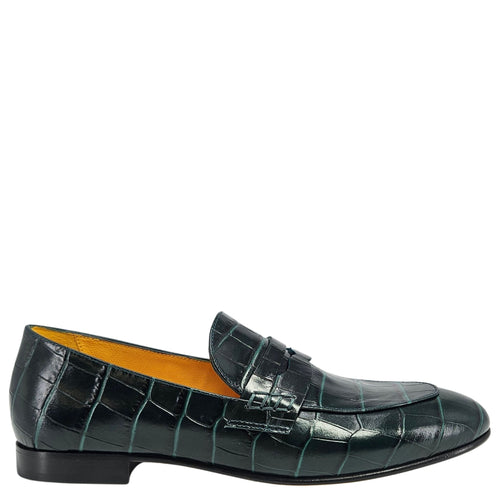 Green crocodile-patterned loafer shoe on a white background