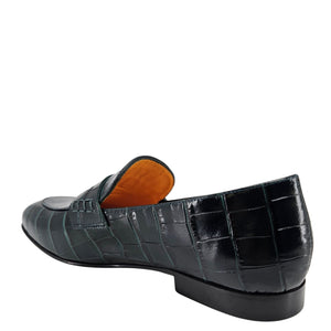 Black crocodile-patterned loafer shoe on a white background