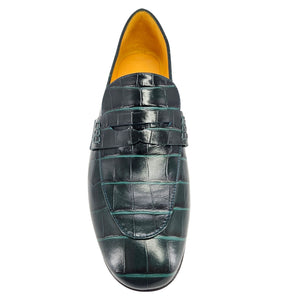 Green crocodile-patterned loafer shoe on a white background
