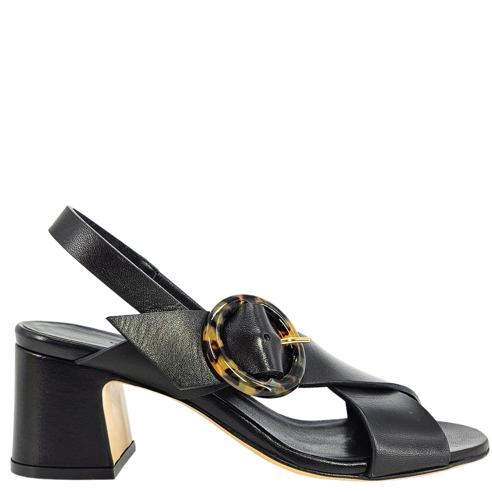 Black sandal with a tortoiseshell buckle on a white background