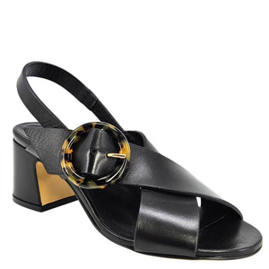 Black sandal with a tortoiseshell buckle on a white background
