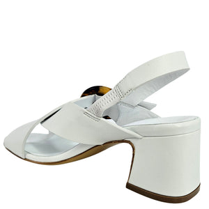 White sandal with a block heel on a white background