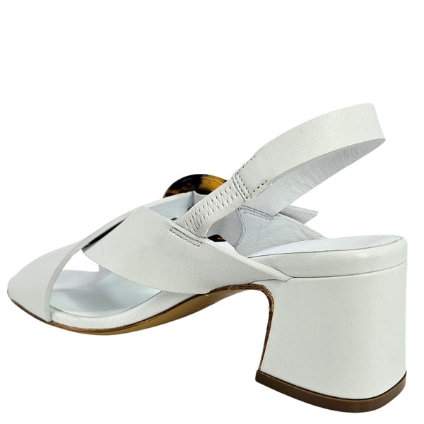 White sandal with a block heel on a white background