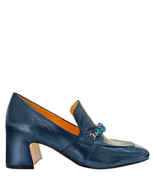 A leather heeled loafer with a block heel and square toe, featuring a decorative band with faceted gemstone-style embellishments across the upper. Designed by Madison in Beverly Hills and handcrafted in Italy.