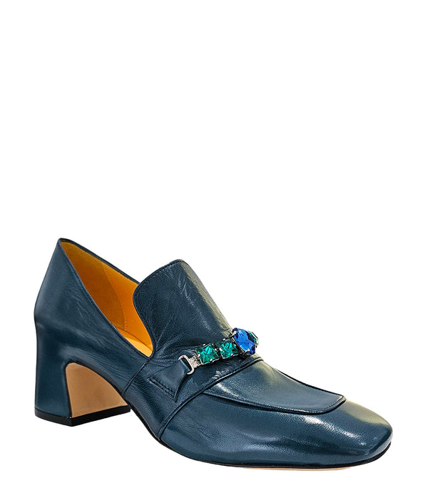 A leather heeled loafer with a block heel and square toe, featuring a decorative band with faceted gemstone-style embellishments across the upper. Designed by Madison in Beverly Hills and handcrafted in Italy.