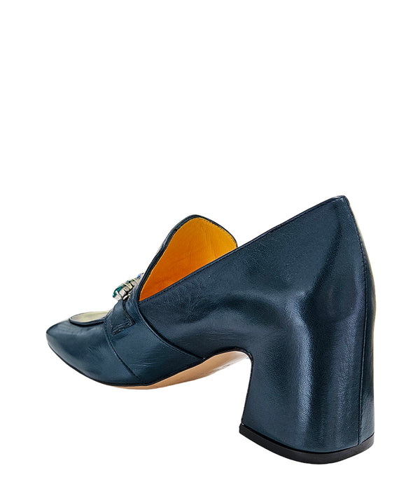 A leather heeled loafer with a block heel and square toe, featuring a decorative band with faceted gemstone-style embellishments across the upper. Designed by Madison in Beverly Hills and handcrafted in Italy.