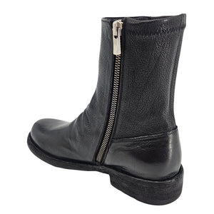 A black leather ankle boot with a low heel and a slightly textured finish.
