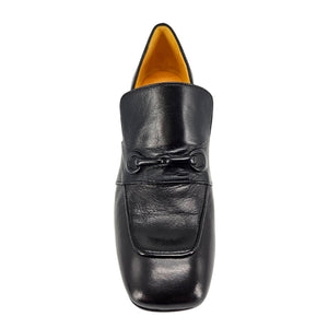 Black leather loafer shoe on a white background