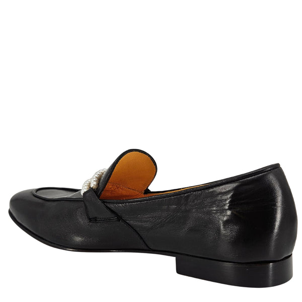 Black loafer shoe with a pearl detail on a white background