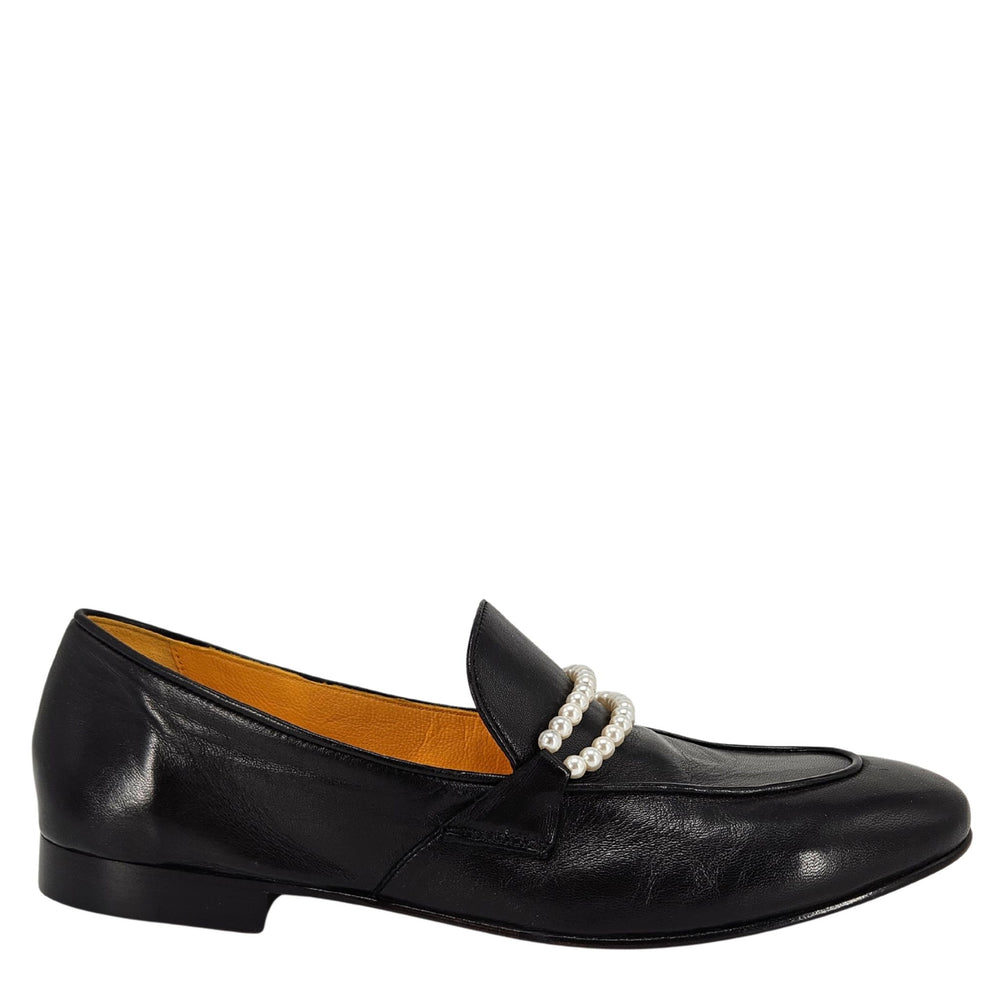 Black loafer shoe with pearl embellishment on a white background