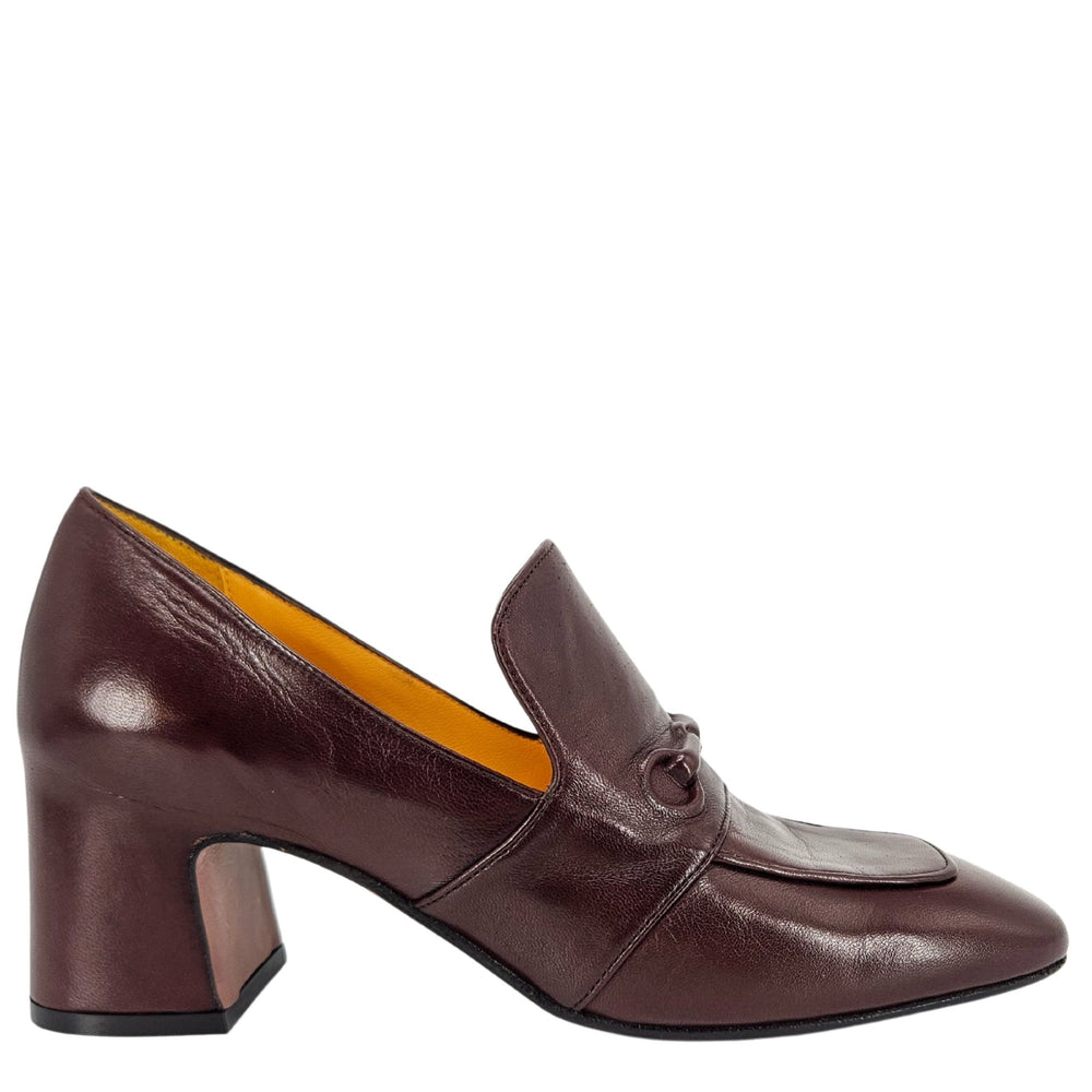 Brown leather shoe with a block heel on a white background