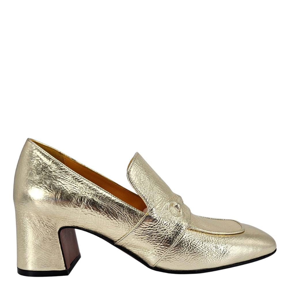 Gold metallic loafer shoe on a white background