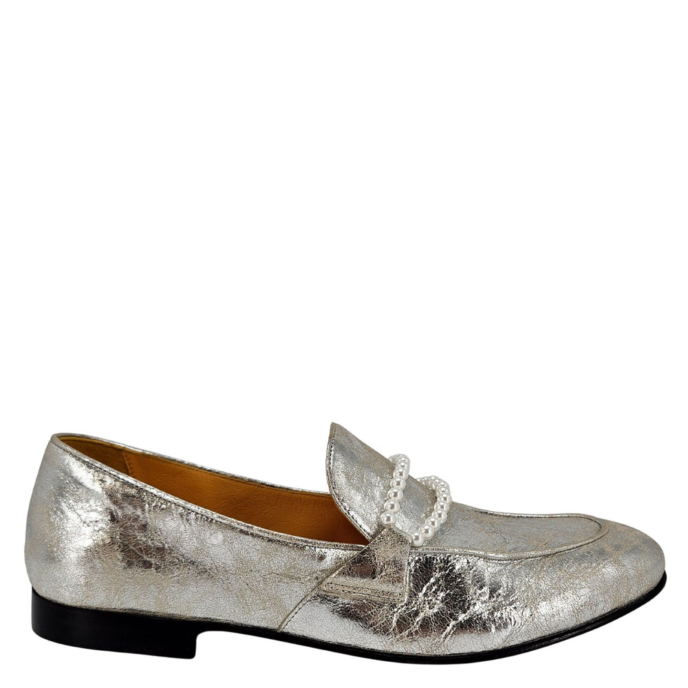 Silver loafer shoe with a decorative bow on a white background