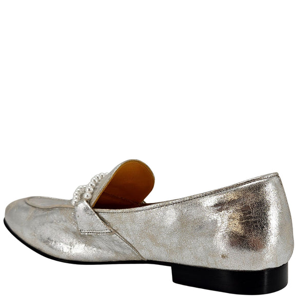 Silver metallic loafer shoe on a white background