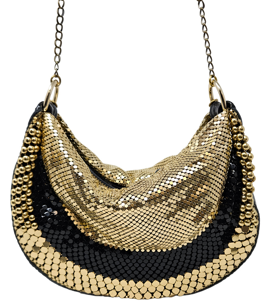 A metallic hobo-style handbag with a black and silver mesh design, accented by large silver beaded trim along the edges. The bag hangs from a silver chain strap and features a soft, slouchy silhouette. Designed by Madison in Beverly Hills