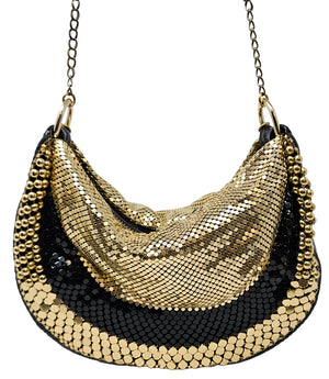 A metallic hobo-style handbag with a black and silver mesh design, accented by large silver beaded trim along the edges. The bag hangs from a silver chain strap and features a soft, slouchy silhouette. Designed by Madison in Beverly Hills