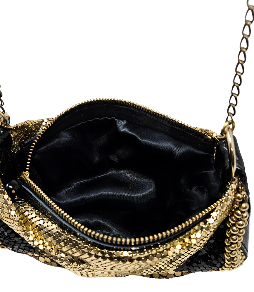 
                      
                        A metallic hobo-style handbag with a black and silver mesh design, accented by large silver beaded trim along the edges. The bag hangs from a silver chain strap and features a soft, slouchy silhouette. Designed by Madison in Beverly Hills
                      
                    