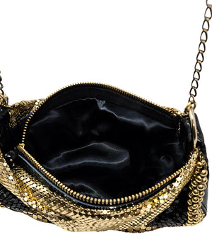 A metallic hobo-style handbag with a black and silver mesh design, accented by large silver beaded trim along the edges. The bag hangs from a silver chain strap and features a soft, slouchy silhouette. Designed by Madison in Beverly Hills